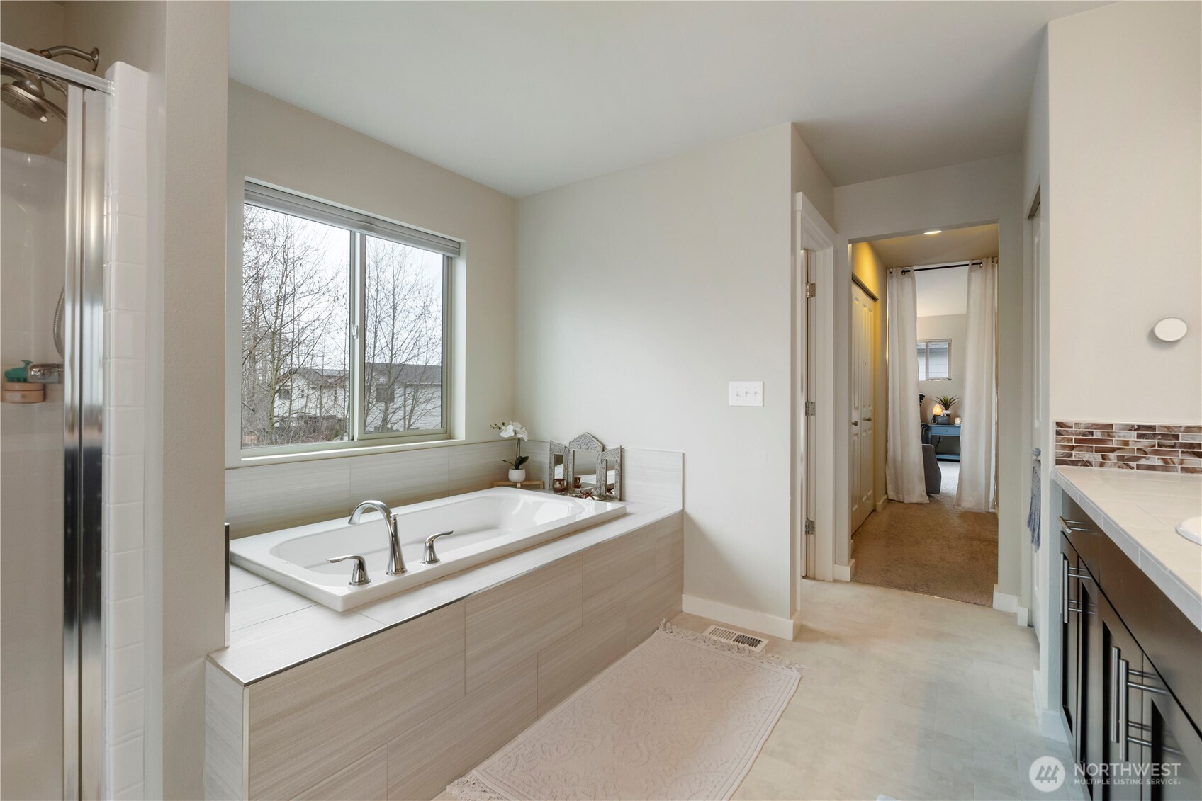 329 South Spruce Street Buckley, WA 98321 - Photo 22 of 36 a bathroom with a tub sink and mirror