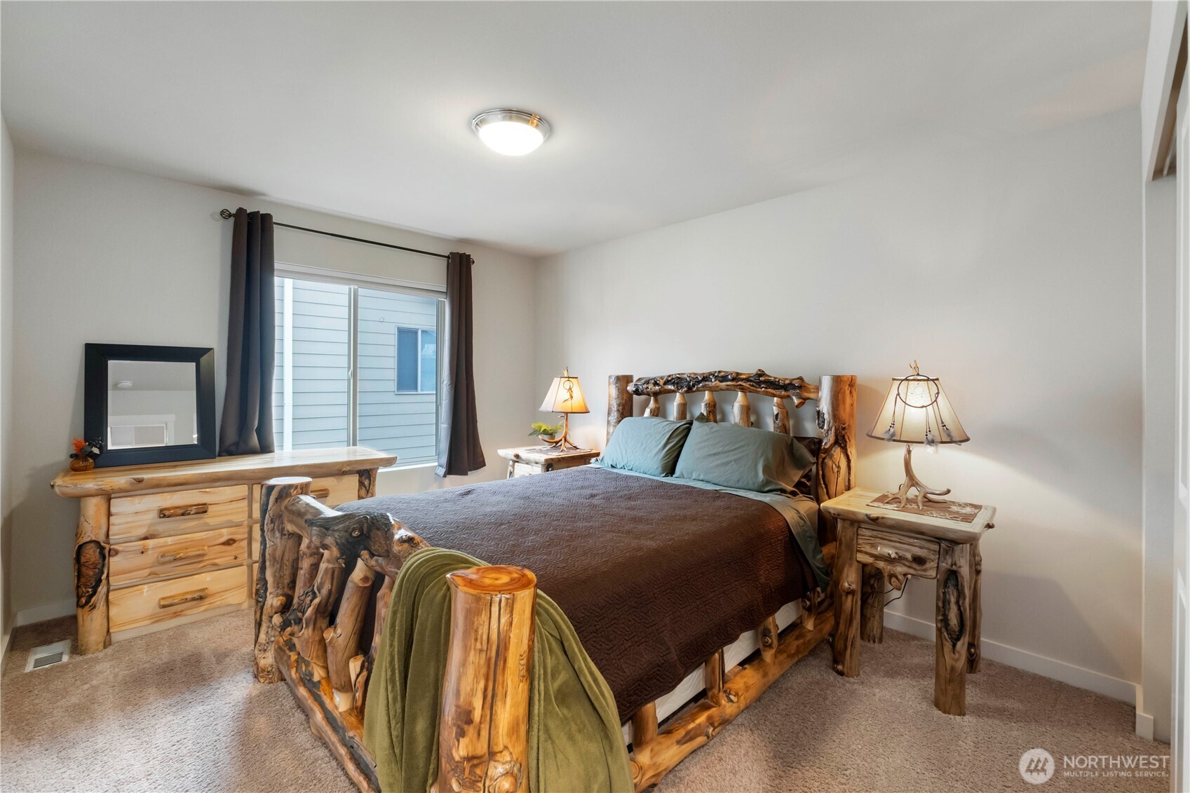 329 South Spruce Street Buckley, WA 98321 - Photo 24 of 36 a bedroom with a bed and a dresser