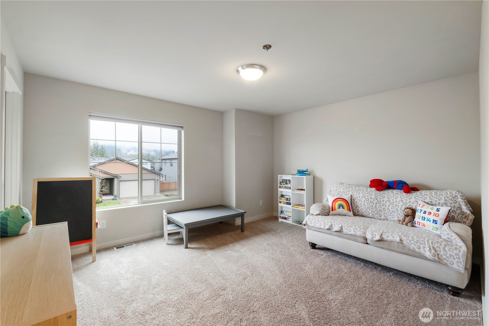 329 South Spruce Street Buckley, WA 98321 - Photo 25 of 36 a bedroom with furniture and a large window