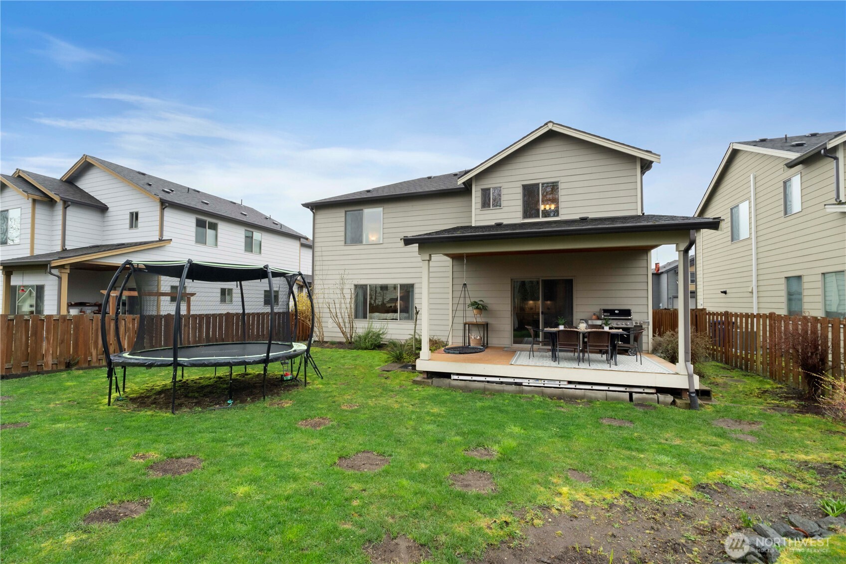 329 South Spruce Street Buckley, WA 98321 - Photo 29 of 36 a view of a house with a yard and sitting area