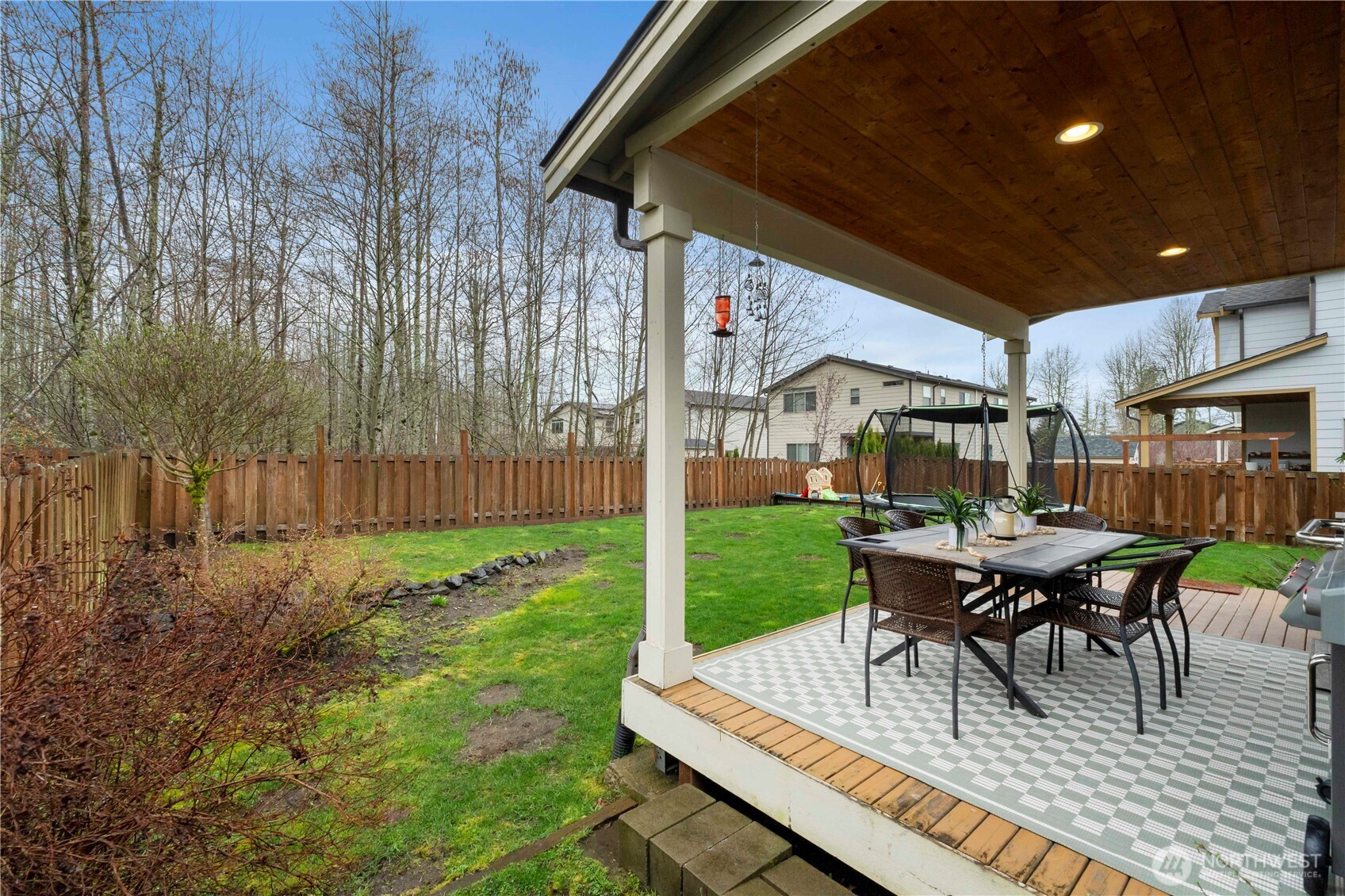 329 South Spruce Street Buckley, WA 98321 - Photo 31 of 36 a view of a patio with table and chairs and potted plants