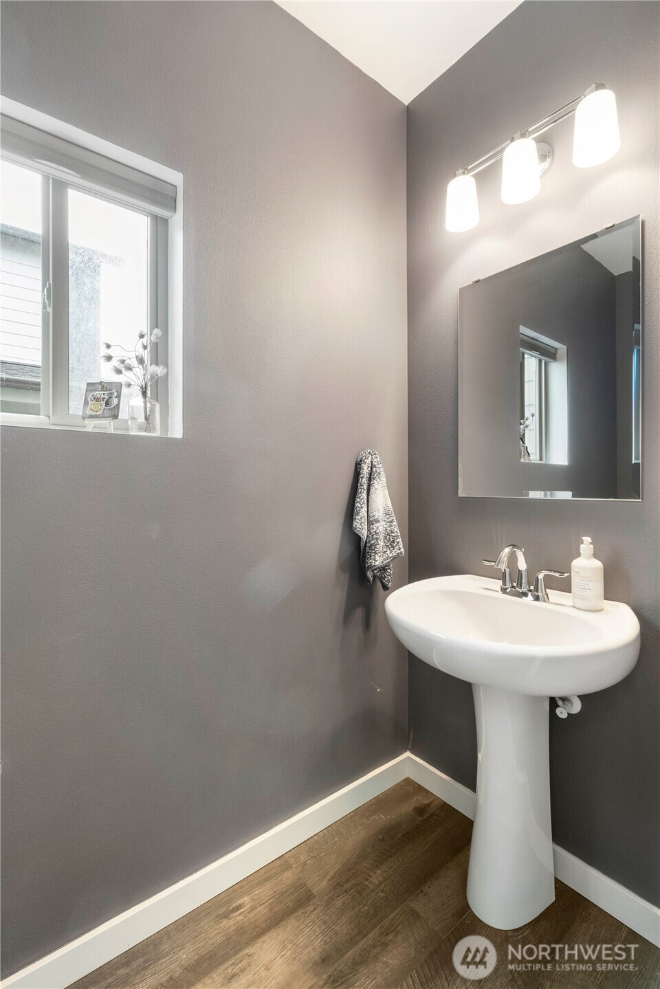 329 South Spruce Street Buckley, WA 98321 - Photo 6 of 36 a bathroom with a sink mirror and vanity