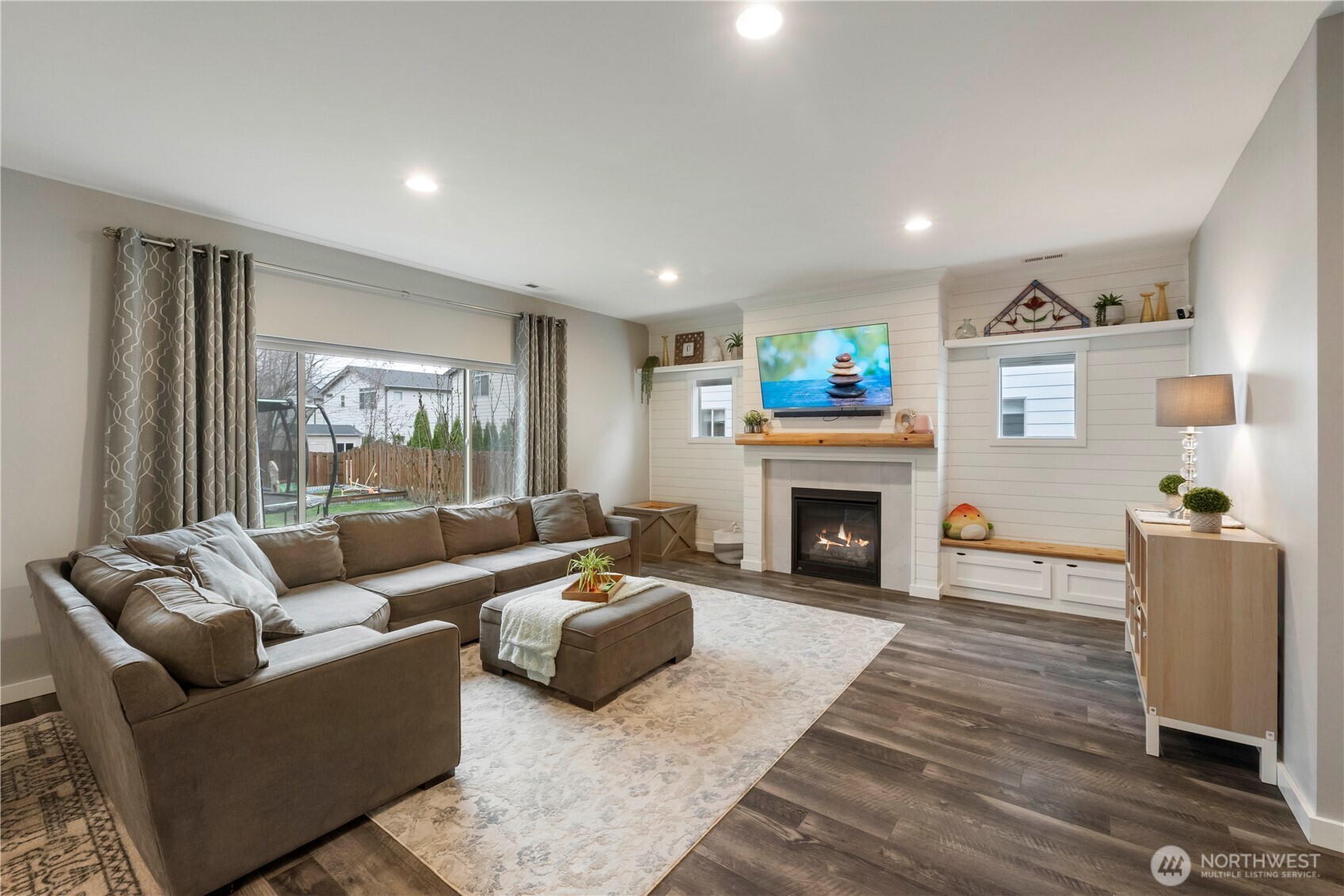 329 South Spruce Street Buckley, WA 98321 - Photo 8 of 36 a living room with furniture and a fireplace