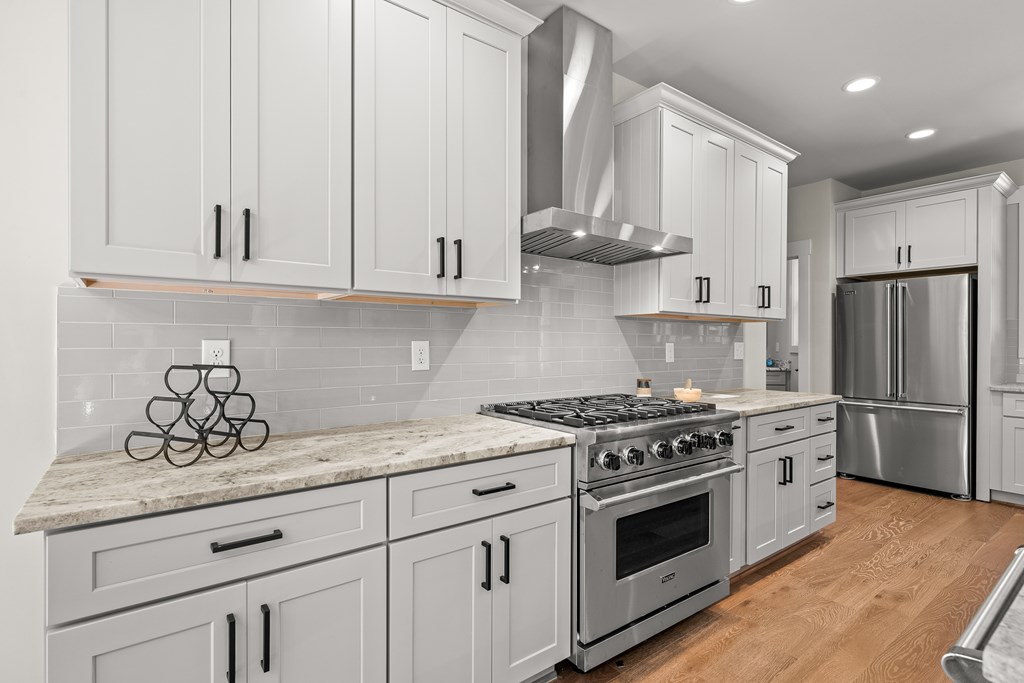 158 Treeline Lane Ellijay, GA 30540 - Photo 13 of 95 a kitchen with stainless steel appliances granite countertop a sink a stove and a refrigerator