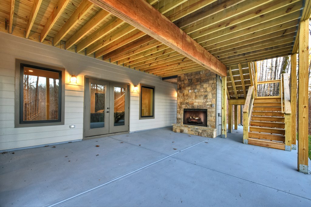 158 Treeline Lane Ellijay, GA 30540 - Photo 27 of 95 a view of an empty room with a fireplace and a window