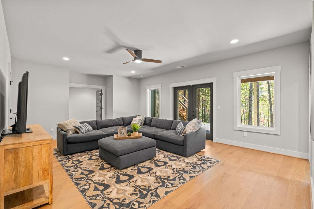 158 Treeline Lane Ellijay, GA 30540 - Photo 35 of 95 a living room with furniture and a flat screen tv