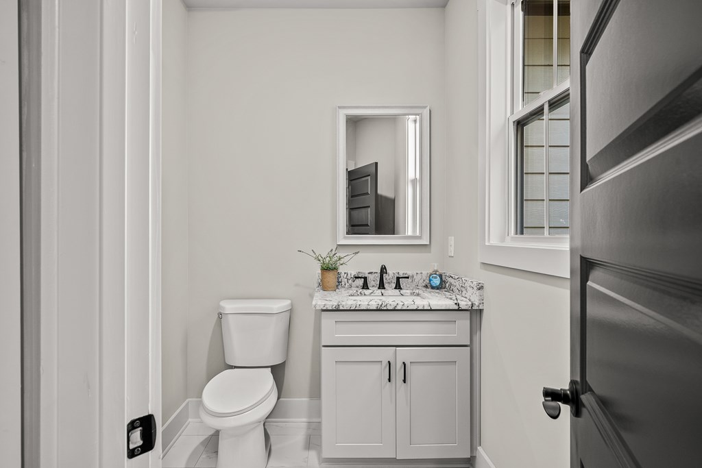 158 Treeline Lane Ellijay, GA 30540 - Photo 68 of 95 a bathroom with a toilet sink and mirror