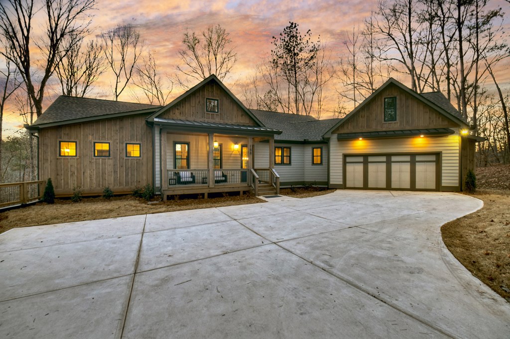 158 Treeline Lane Ellijay, GA 30540 - Photo 88 of 95 a front view of a house with a yard and garage
