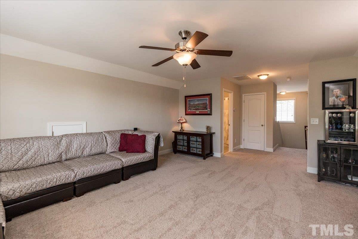 3441 Grosbeak Way Raleigh, NC 27616 - Photo 22 of 25 a living room with furniture and kitchen view