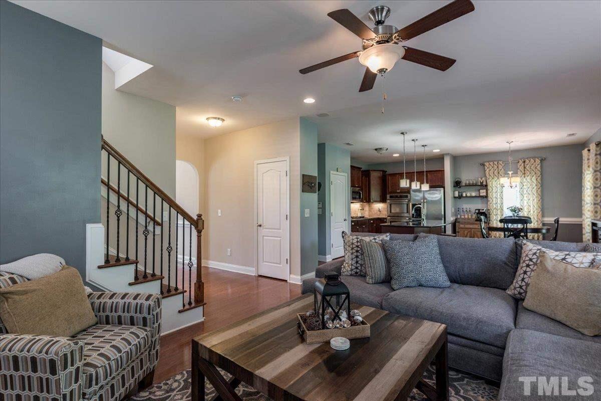 3441 Grosbeak Way Raleigh, NC 27616 - Photo 5 of 25 a living room with furniture and a dining table
