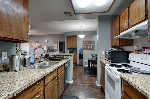 a kitchen with a stove and a microwave
