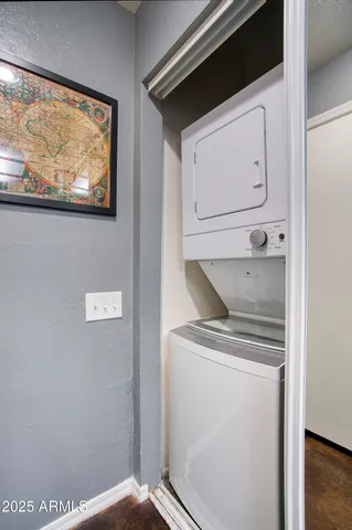 a kitchen with stove cabinets and stainless steel appliances