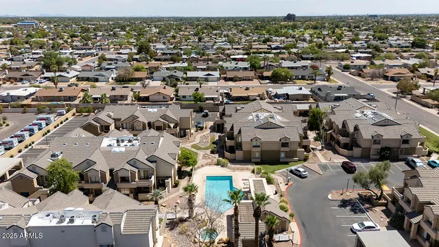 an aerial view of houses with outdoor space