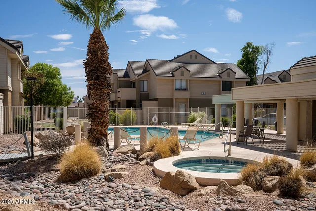 a kitchen with a table and chairs in it