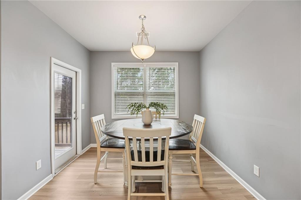 95 Denver Avenue Hiram, GA 30141 - Photo 15 of 62 a view of a dining room with furniture window and wooden floor