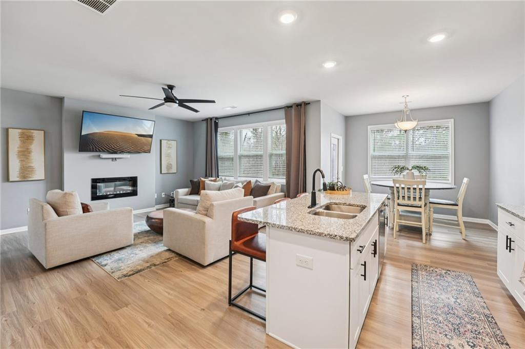 95 Denver Avenue Hiram, GA 30141 - Photo 19 of 62 a living room with furniture a fireplace and a table