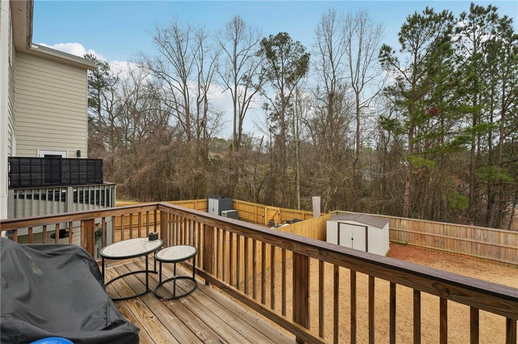 95 Denver Avenue Hiram, GA 30141 - Photo 25 of 62 a view of a balcony with wooden floor and fence