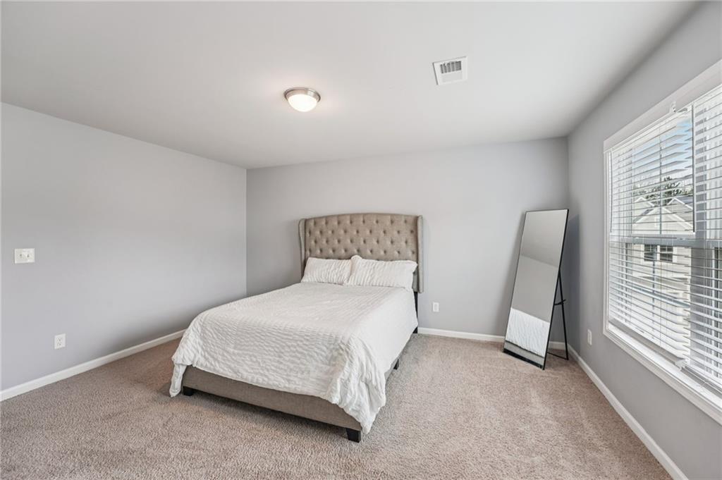 95 Denver Avenue Hiram, GA 30141 - Photo 40 of 62 a bedroom with a bed and a window