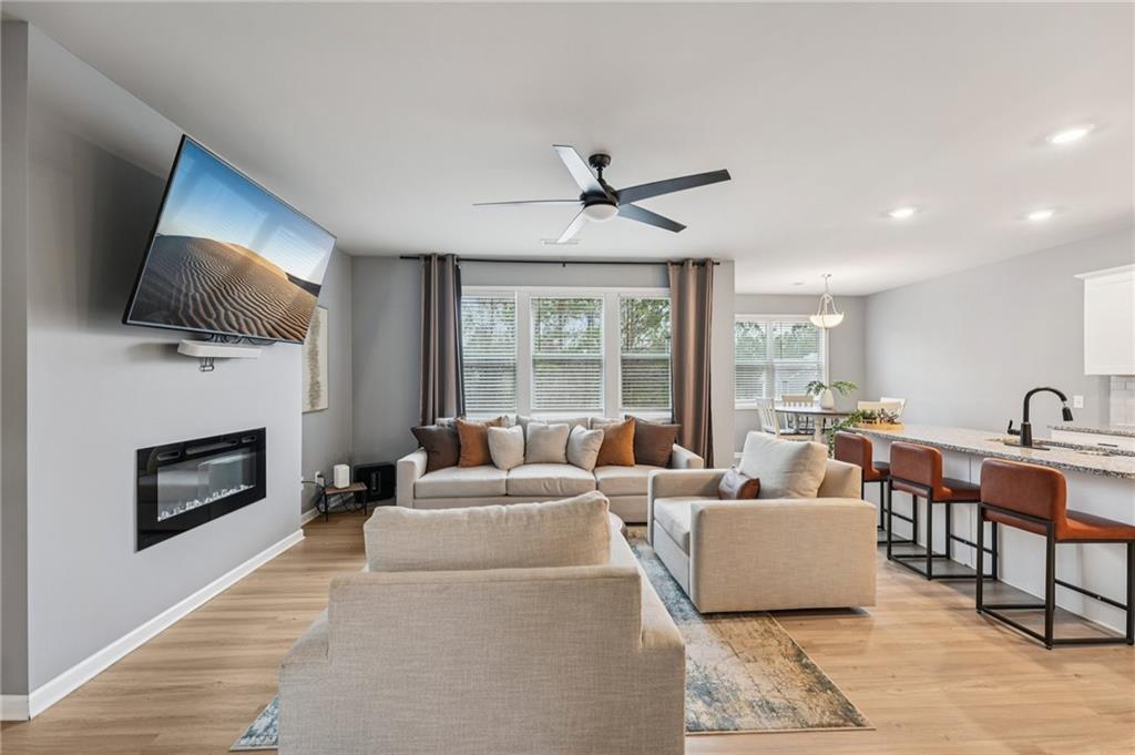95 Denver Avenue Hiram, GA 30141 - Photo 8 of 62 a living room with fireplace furniture and a flat screen tv