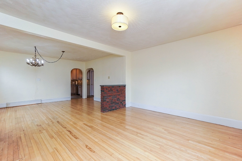 51 Wallingford Road Boston, MA 02135 - Photo 14 of 42 a view of a room with wooden floor and ceiling fan