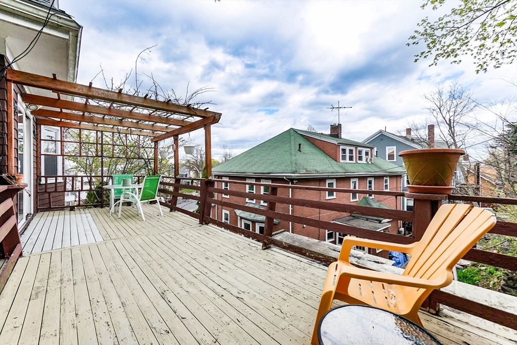 51 Wallingford Road Boston, MA 02135 - Photo 17 of 42 a view of a roof deck with wooden floor
