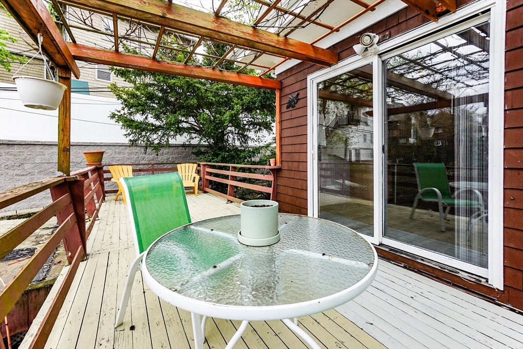51 Wallingford Road Boston, MA 02135 - Photo 18 of 42 a dining room with a table and chairs