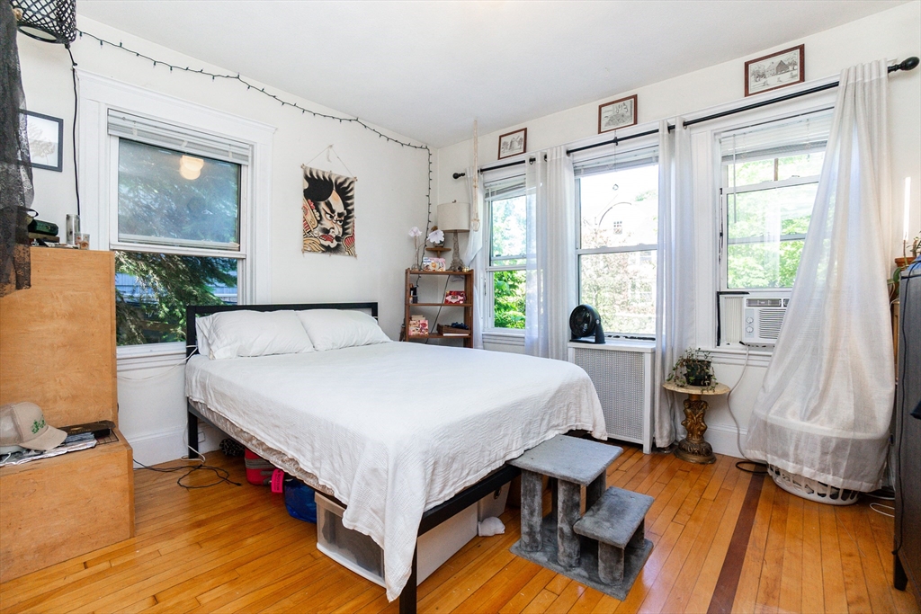 51 Wallingford Road Boston, MA 02135 - Photo 19 of 42 a bed room with a bed and a window