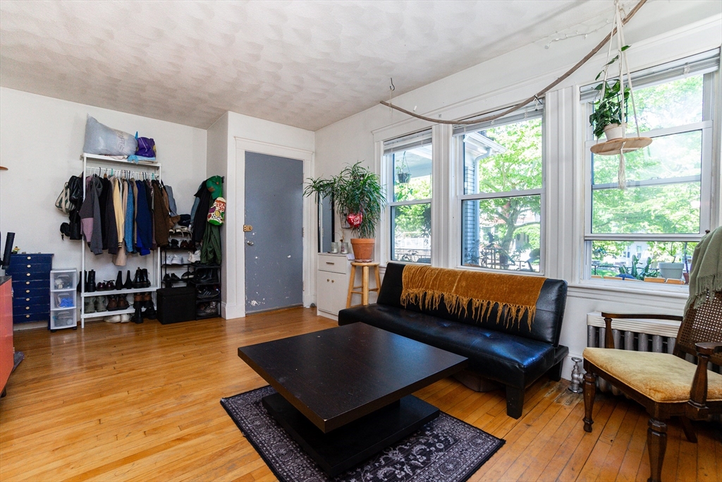 51 Wallingford Road Boston, MA 02135 - Photo 24 of 42 a living room with furniture and a rug
