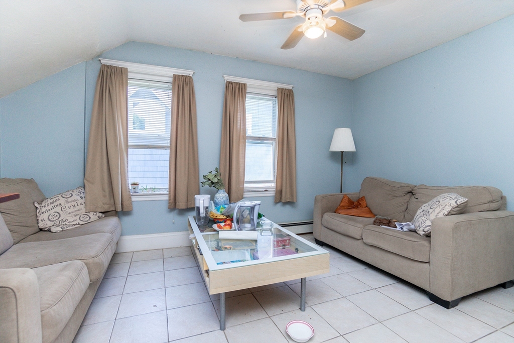 51 Wallingford Road Boston, MA 02135 - Photo 29 of 42 a living room with furniture and a large window