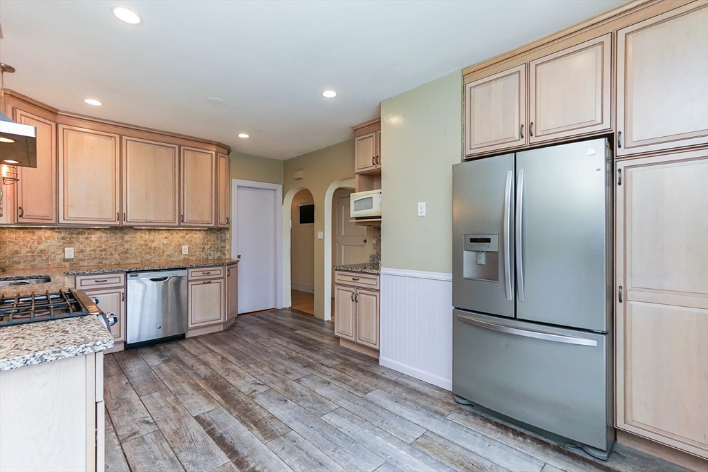 51 Wallingford Road Boston, MA 02135 - Photo 4 of 42 a kitchen with a refrigerator and a sink