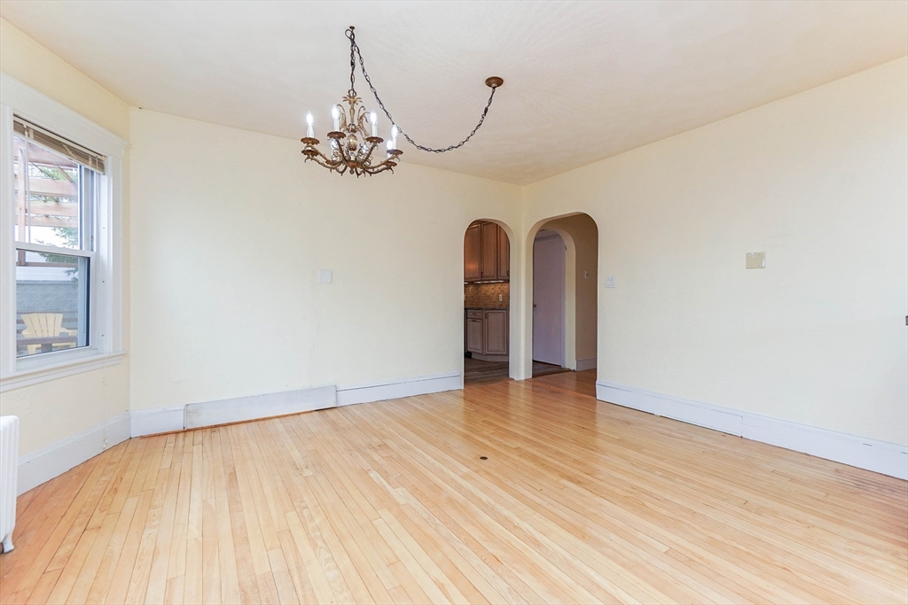 51 Wallingford Road Boston, MA 02135 - Photo 10 of 42 wooden floor in a hall with a window