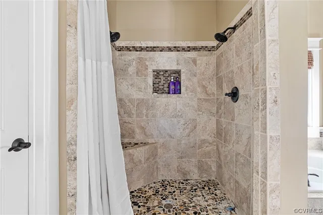 a bathroom with a shower and a sink