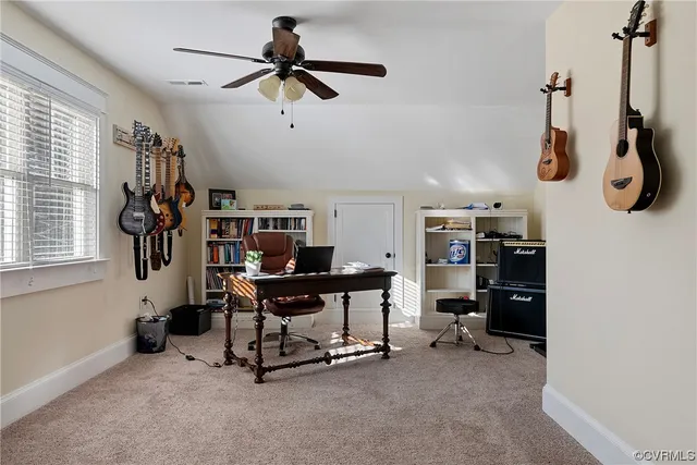 a view of a workspace with furniture