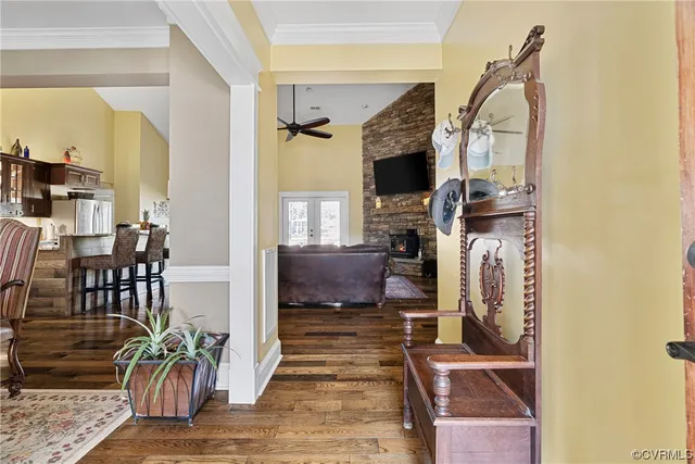 a view of living room kitchen and entryway