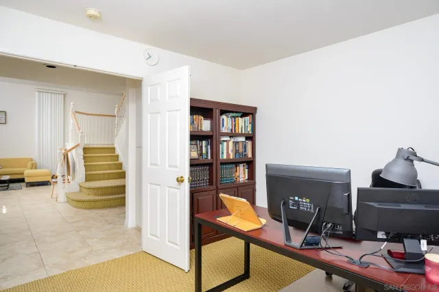 a view of a workspace with furniture and toys