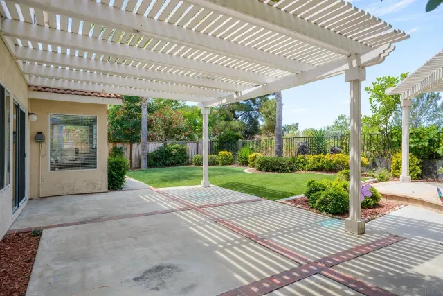 a view of a patio with a yard
