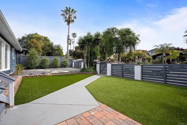 a view of a garden and swimming pool
