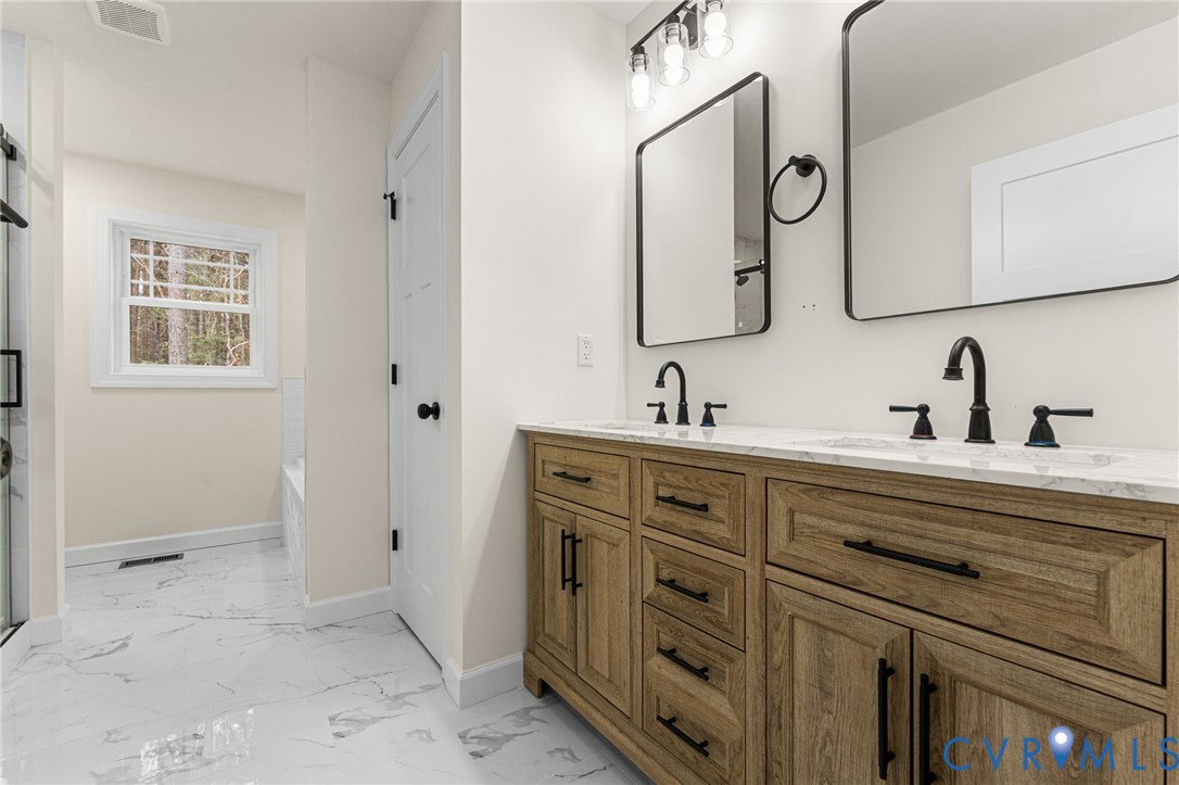 5132 Sunnyside Road Tappahannock, VA 22560 - Photo 17 of 28 a bathroom with a double vanity sink mirror and