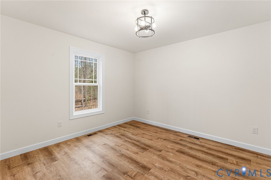 5132 Sunnyside Road Tappahannock, VA 22560 - Photo 22 of 28 an empty room with a window