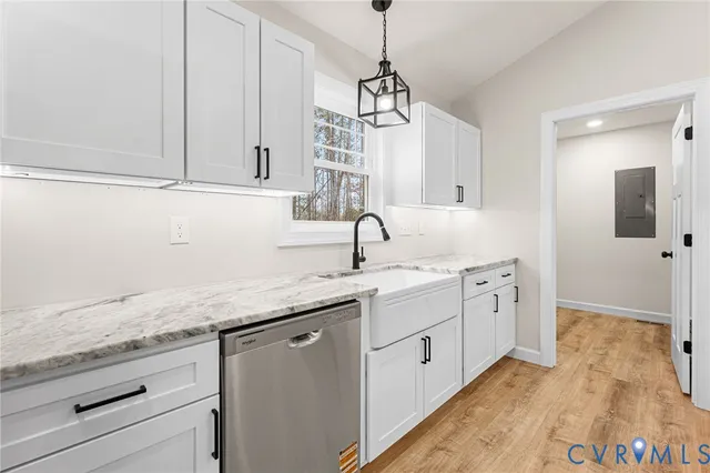a kitchen with sink and cabinets