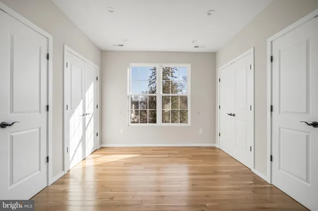 a bathroom with a sink a toilet and window