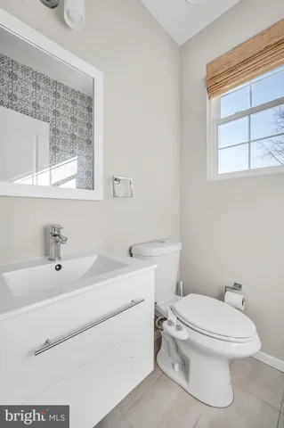 a bathroom with a sink a toilet and a bathtub