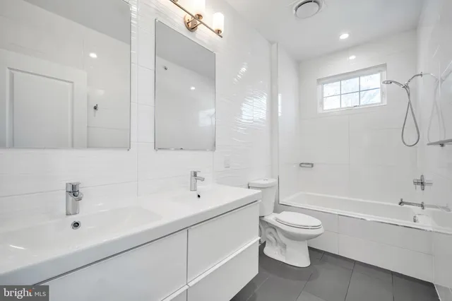 a white bath tub sitting in a bathroom