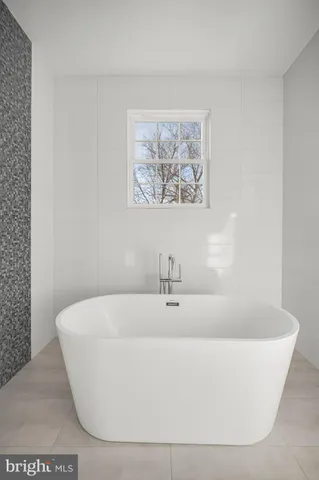 a bathroom with a double vanity sink a mirror and a shower