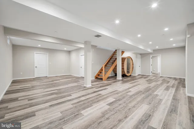 a bathroom with a black and white checkered floor