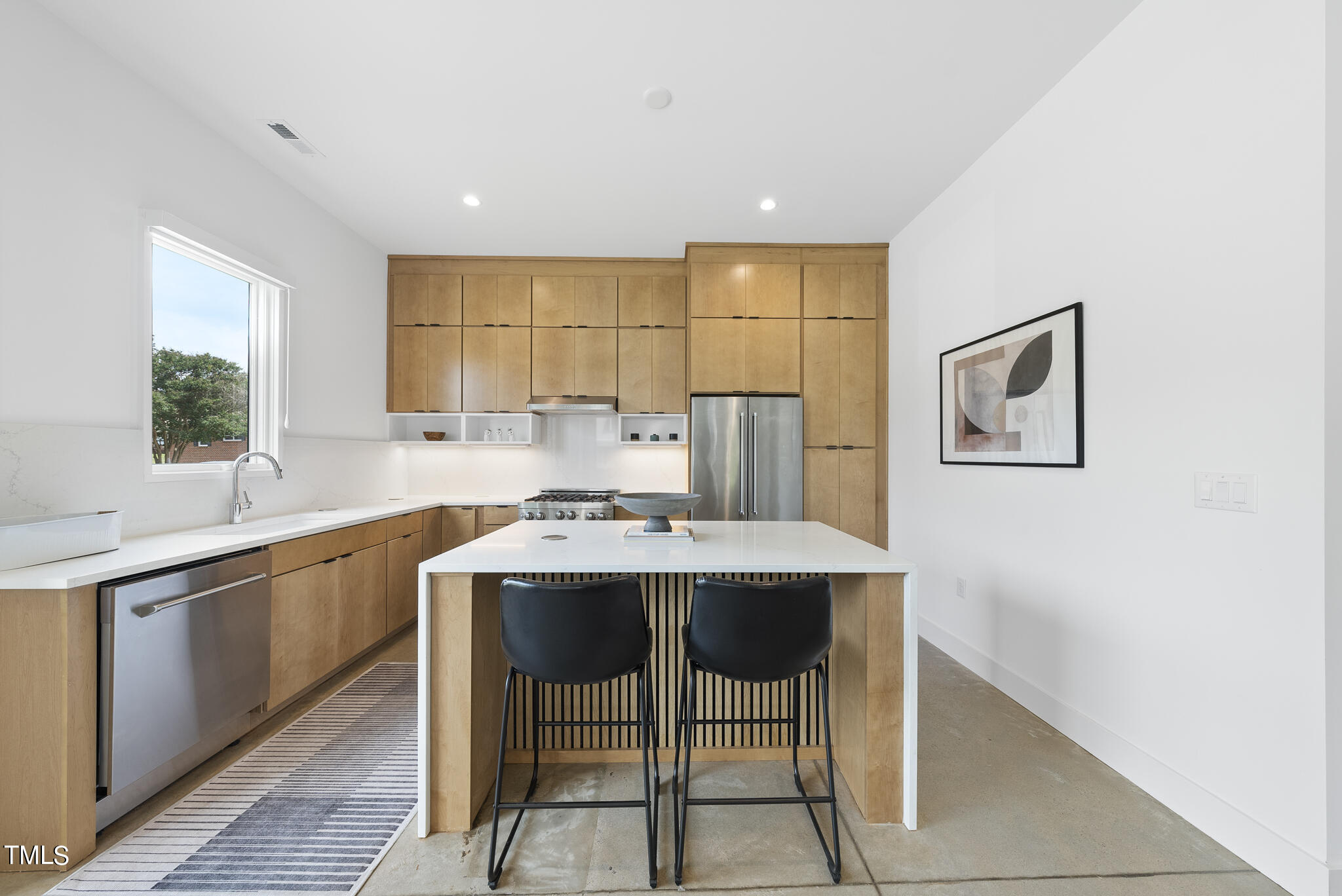 1012 Parker Street Raleigh, NC 27607 - Photo 10 of 39 a dining hall with stainless steel appliances granite countertop a sink a stove a dining table and chairs