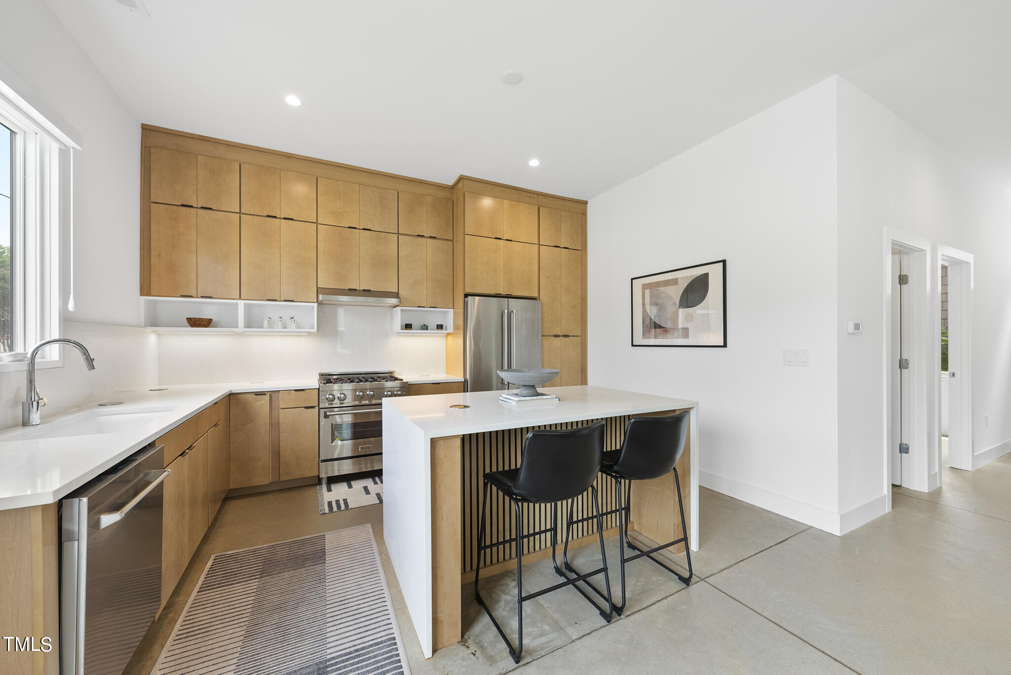 1012 Parker Street Raleigh, NC 27607 - Photo 12 of 39 a kitchen with a sink cabinets and window
