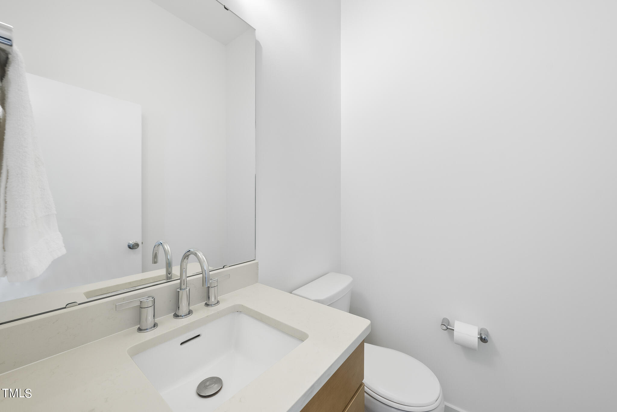 1012 Parker Street Raleigh, NC 27607 - Photo 18 of 39 a bathroom with a sink a toilet and mirror