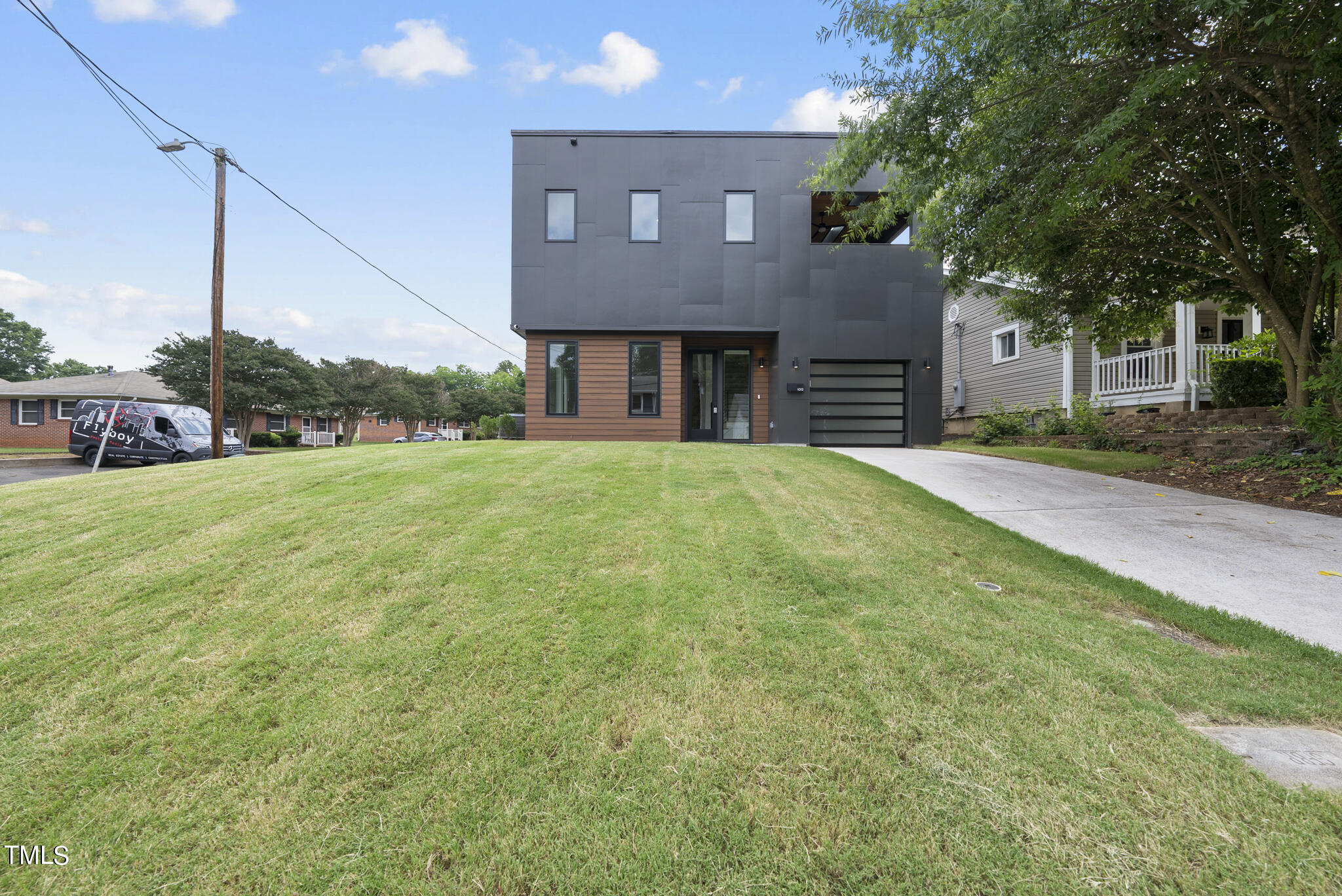 1012 Parker Street Raleigh, NC 27607 - Photo 2 of 39 a house view with a garden space