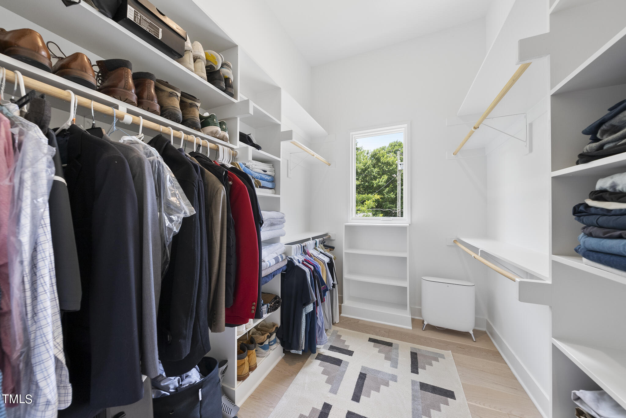 1012 Parker Street Raleigh, NC 27607 - Photo 26 of 39 a view of walk in closet with clothes and shoes